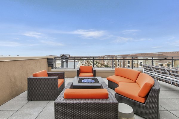 Fire pit with cozy seating at Eastbank Riverwalk Apartments, offering relaxing outdoor leisure options for residents