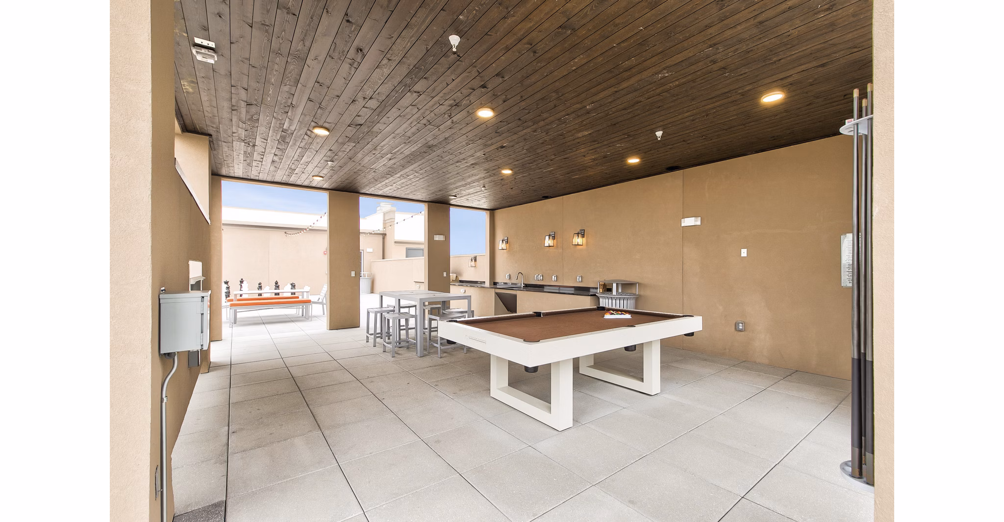 Courtyard with lush greenery at Eastbank Riverwalk Apartments, offering a serene outdoor space for residents to relax and socialize