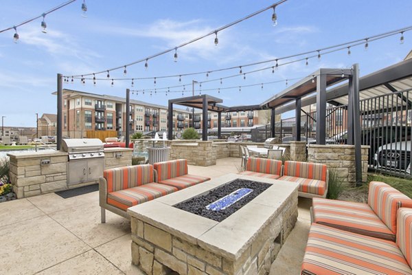 Cozy fire pit lounge area at Eastbank Riverwalk Apartments near scenic river views for luxury relaxation outdoors