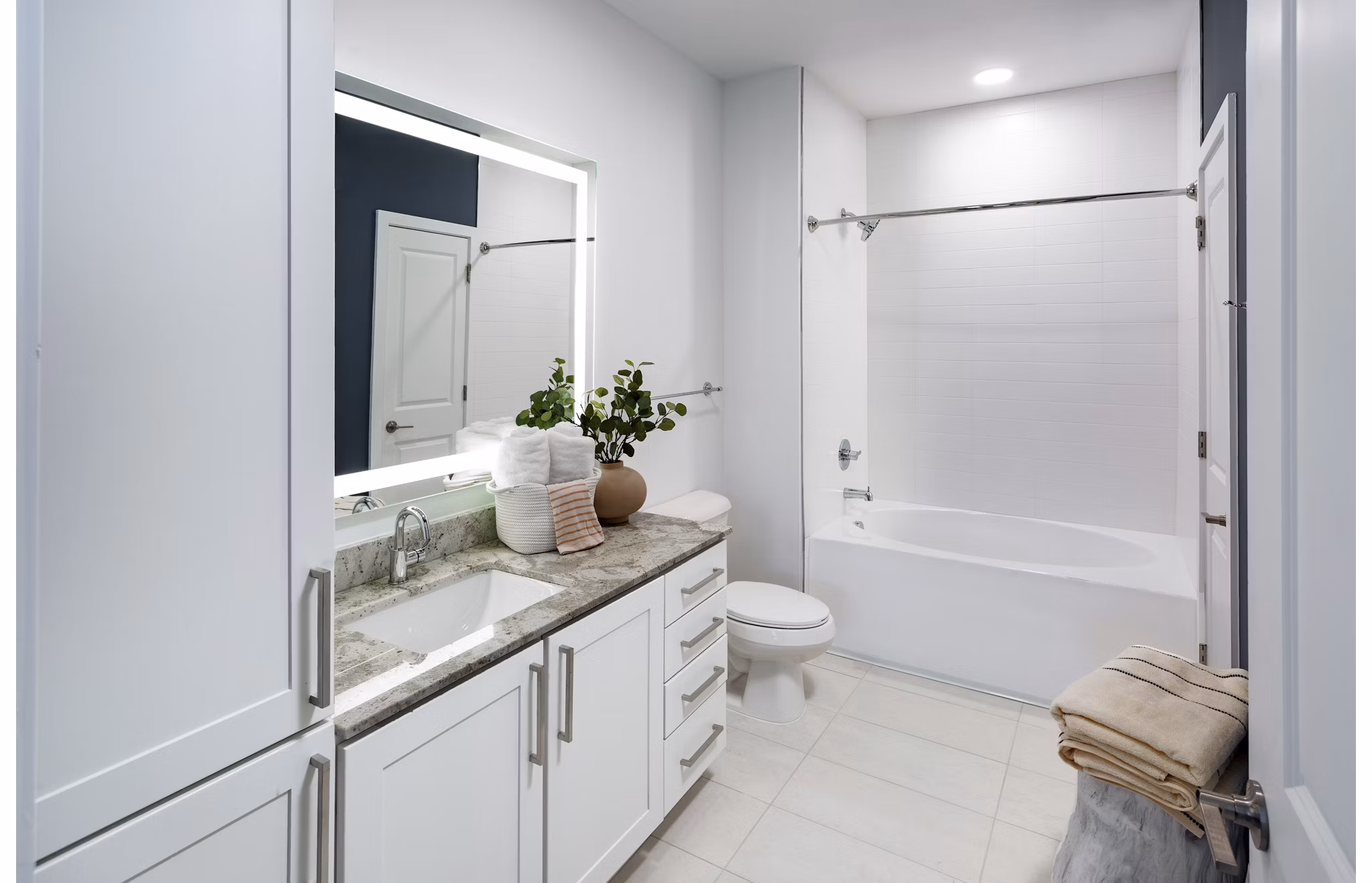 Modern bathroom featuring sleek fixtures at Elan Madison Yards Apartments