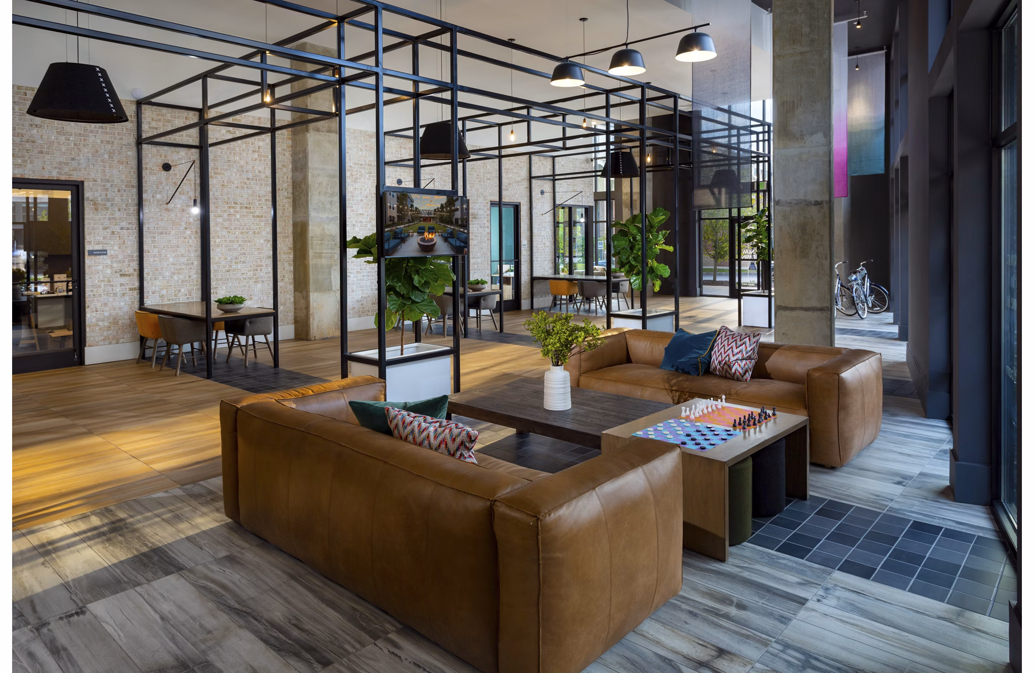 Clubhouse featuring modern design and comfortable seating at Elan Madison Yards Apartments, perfect for social gatherings and relaxation