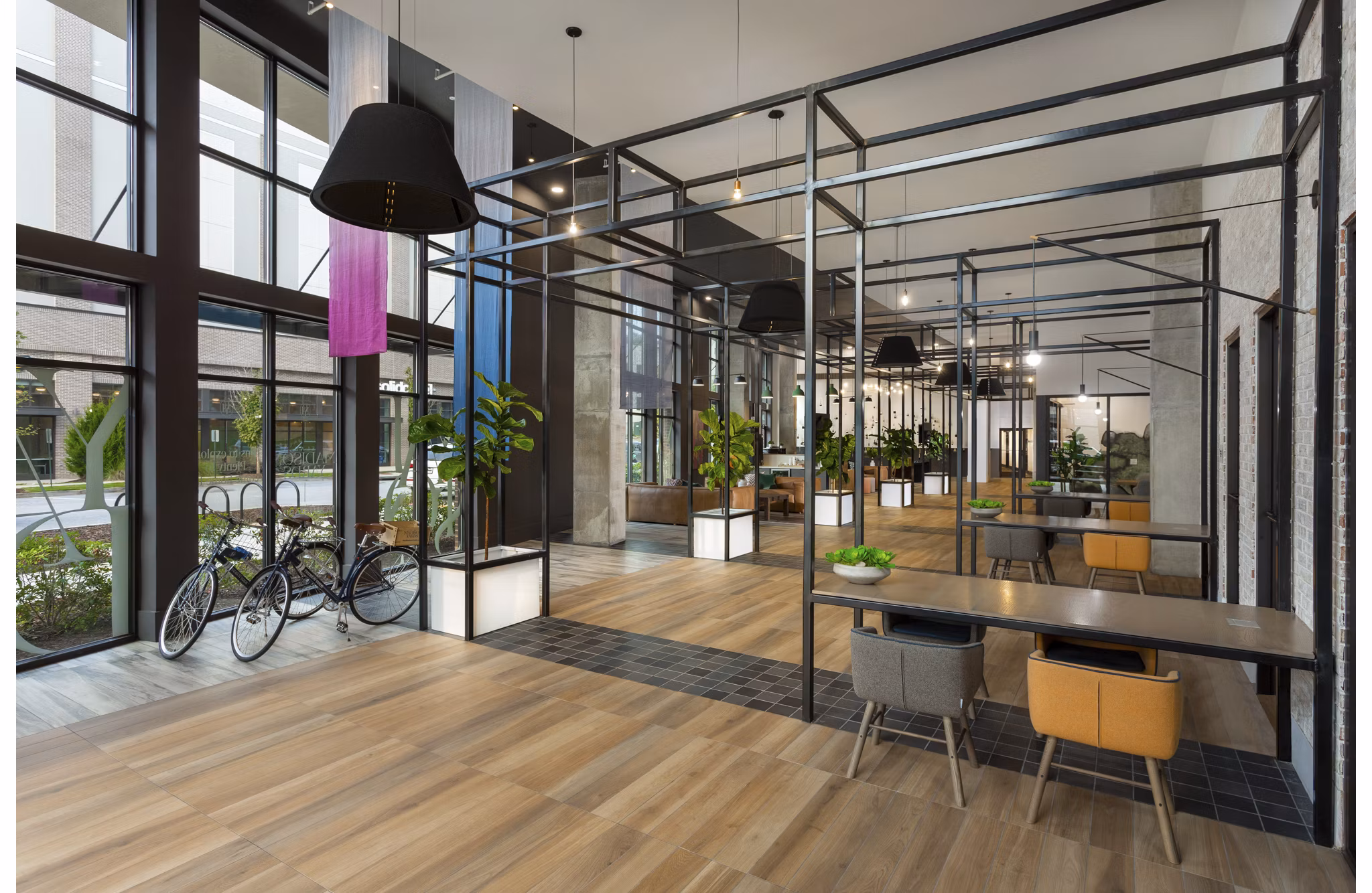 Clubhouse with modern design and ample seating at Elan Madison Yards Apartments