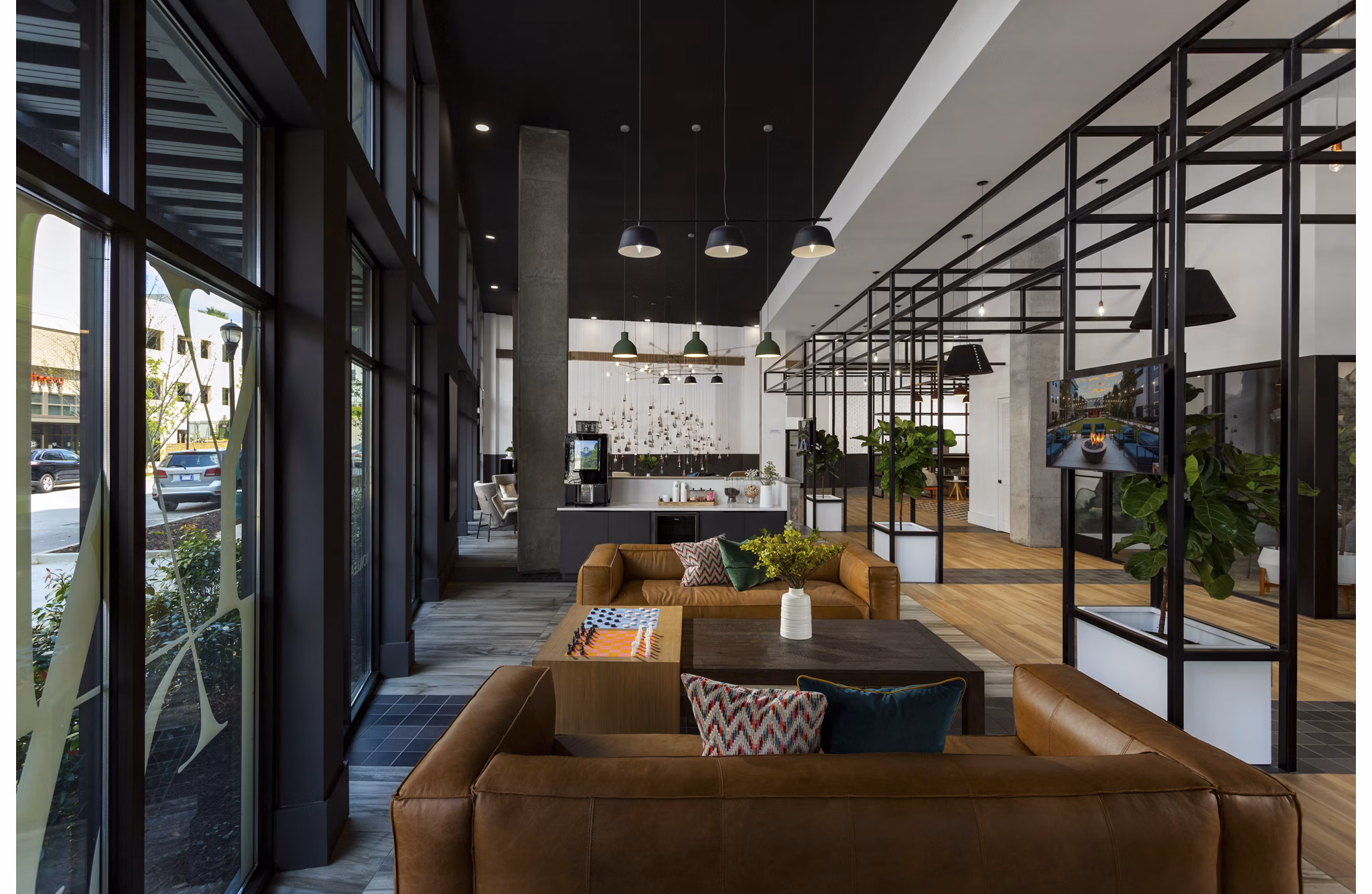 Clubhouse with modern design and ample seating at Elan Madison Yards Apartments