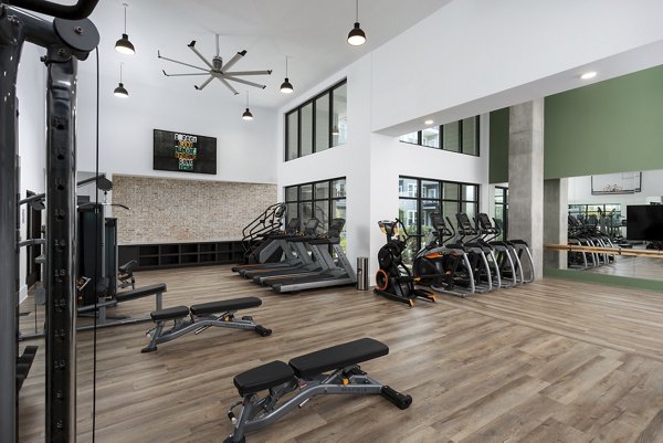 Modern fitness center with state-of-the-art equipment at Elan Madison Yards Apartments