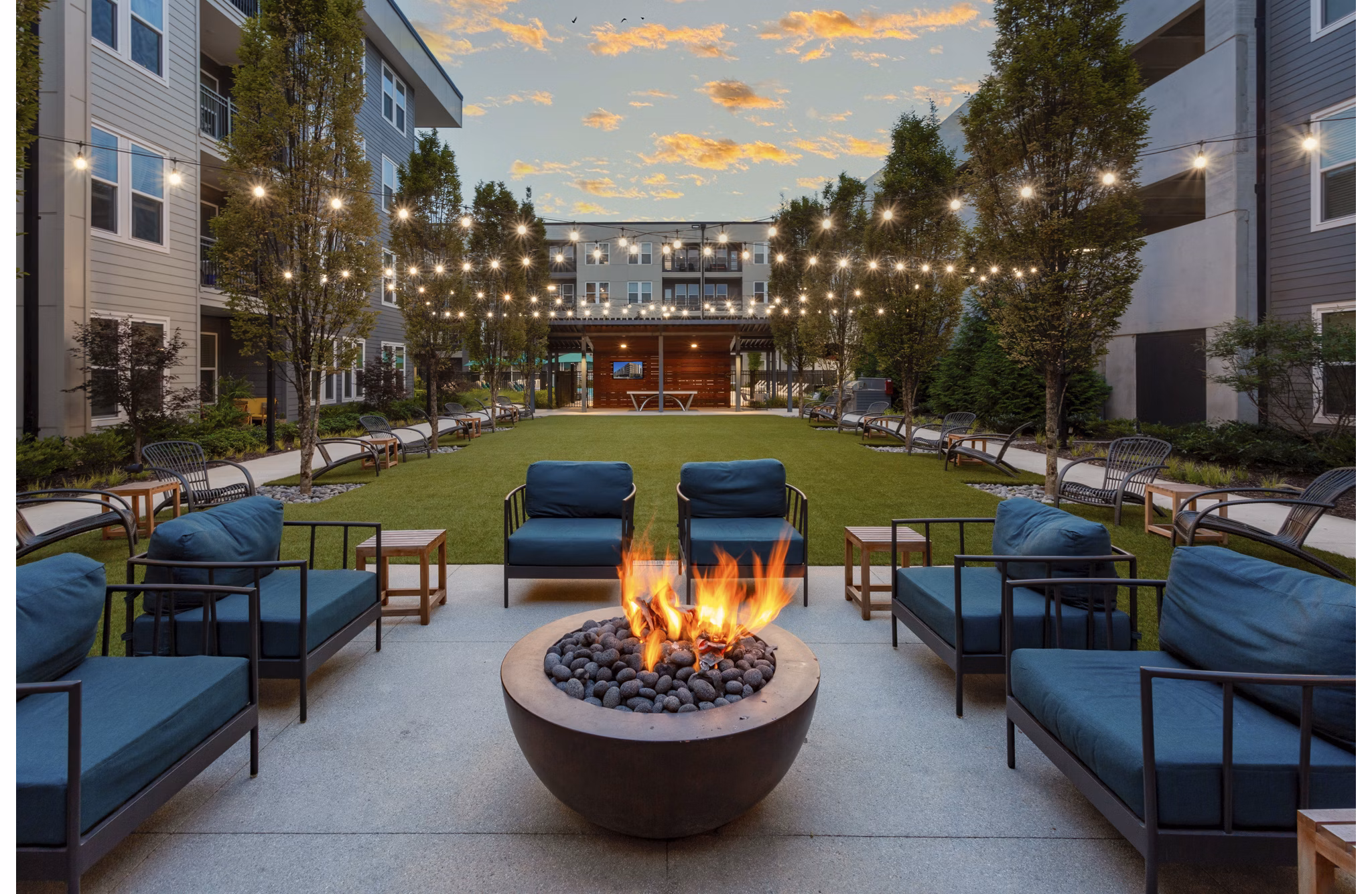Cozy fire pit for socializing at Elan Madison Yards Apartments