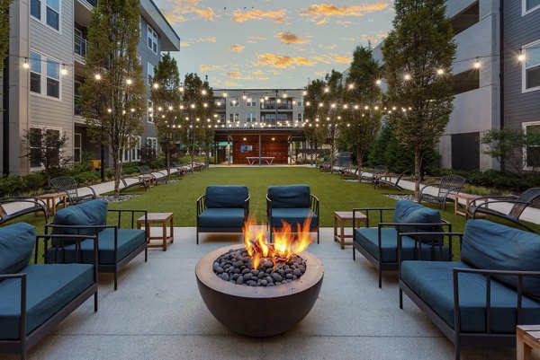 Cozy fire pit for socializing at Elan Madison Yards Apartments