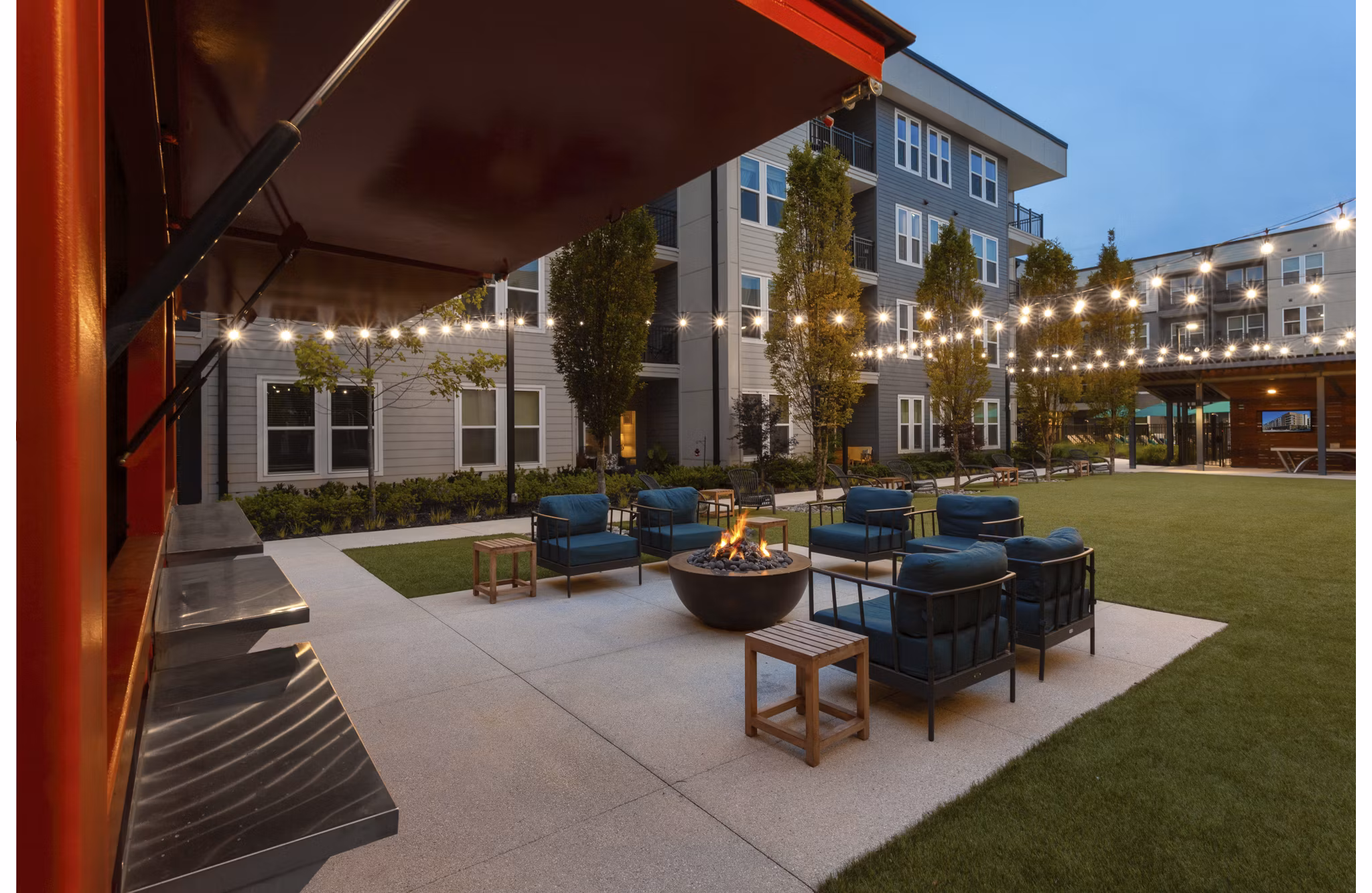 Cozy outdoor fire pit at Elan Madison Yards Apartments, perfect for social gatherings and relaxation in an inviting community space