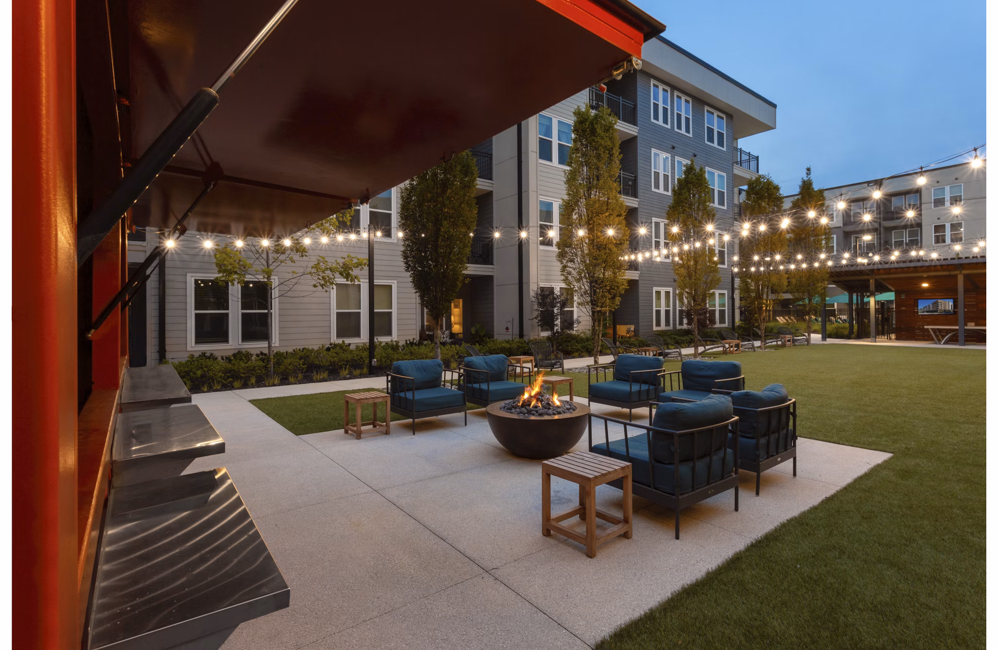 Cozy outdoor fire pit at Elan Madison Yards Apartments, perfect for social gatherings and relaxation in an inviting community space