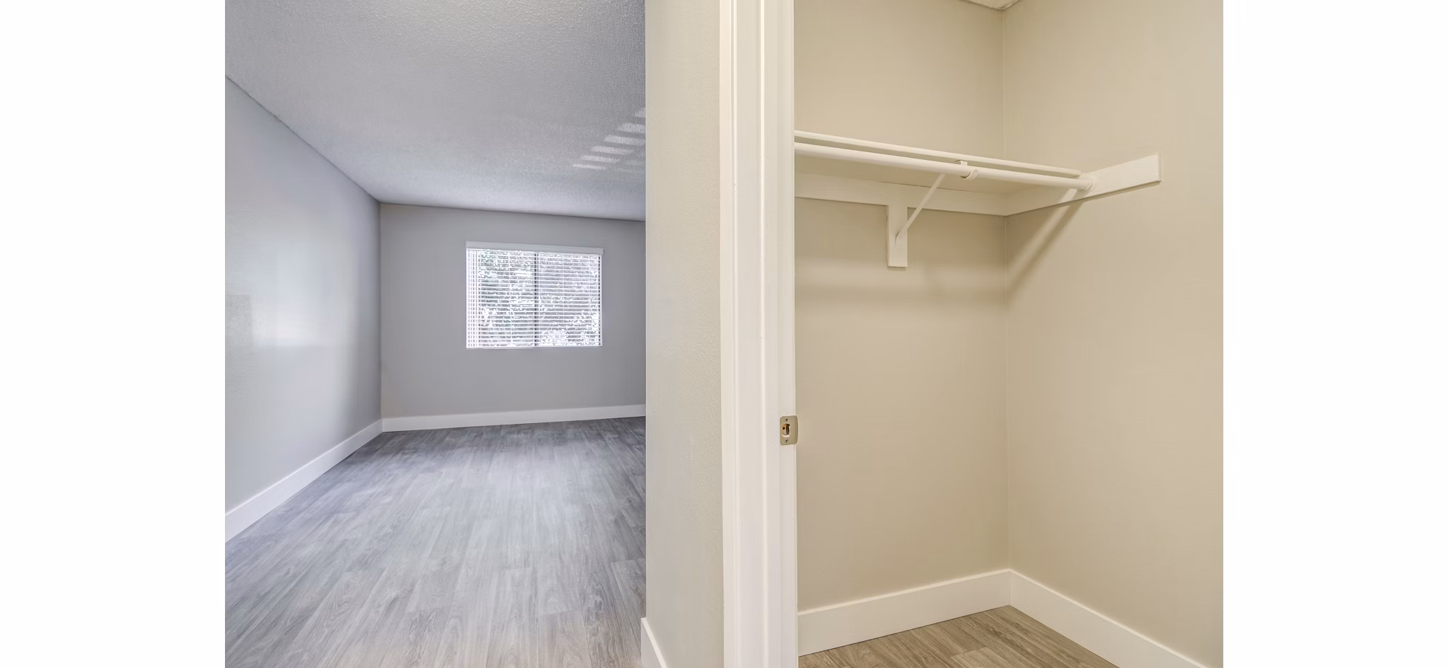 Walk-in closet with custom shelving and ample storage at Presidio at Rancho Del Oro Apartments