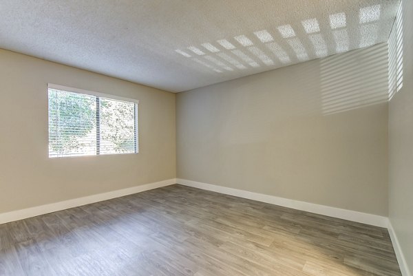 Cozy bedroom with modern decor at Presidio at Rancho Del Oro Apartments