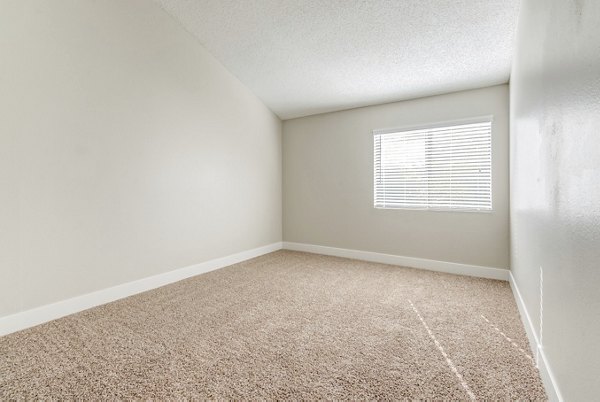 Elegant bedroom with modern decor at Presidio at Rancho Del Oro Apartments