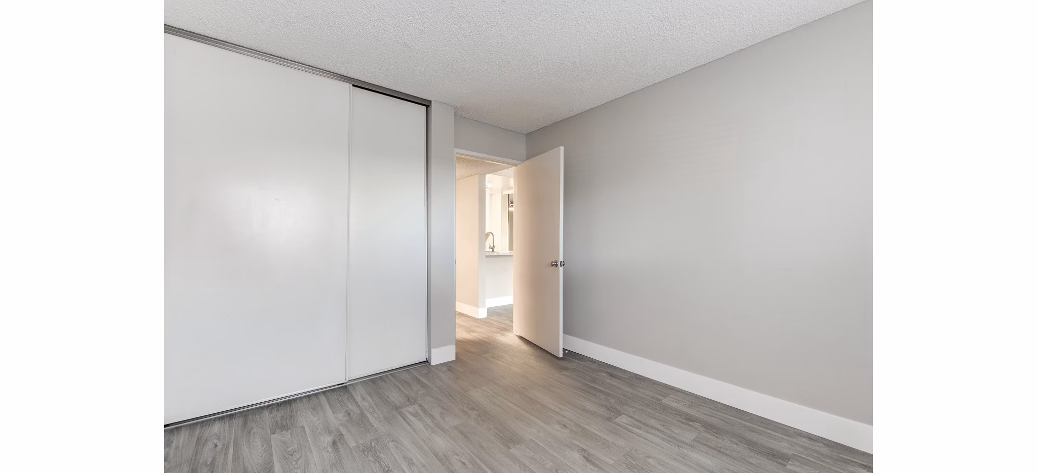 Elegant bedroom with plush bedding at Presidio at Rancho Del Oro Apartments