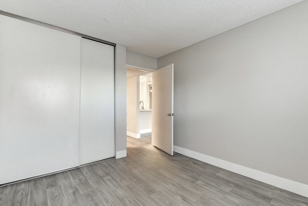 Elegant bedroom with plush bedding at Presidio at Rancho Del Oro Apartments