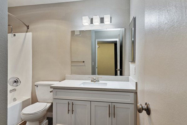 Bathroom featuring elegant fixtures and marble countertops at Presidio at Rancho Del Oro Apartments in a luxurious setting