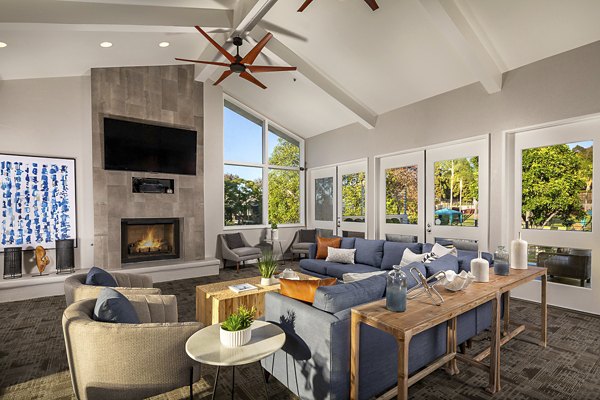 Clubhouse featuring modern lounge areas at Presidio at Rancho Del Oro Apartments, a luxury community by Greystar