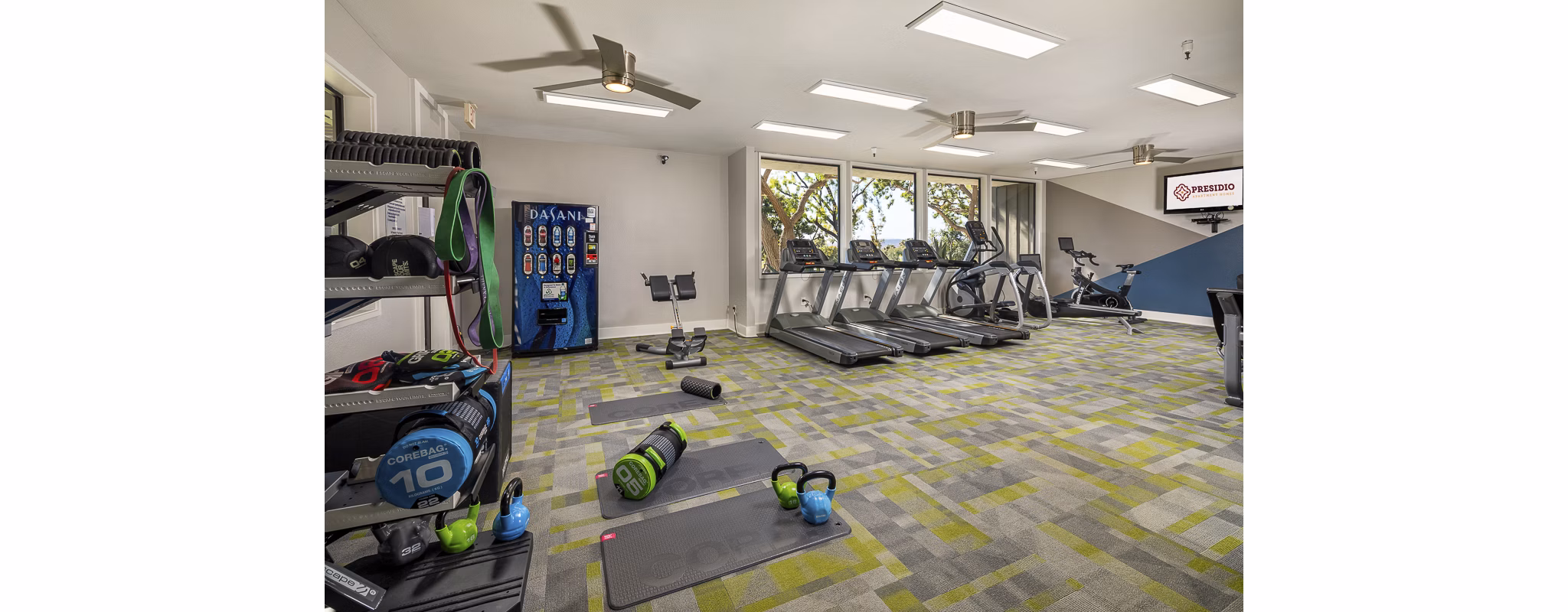 State-of-the-art fitness center at Presidio at Rancho Del Oro Apartments featuring modern equipment