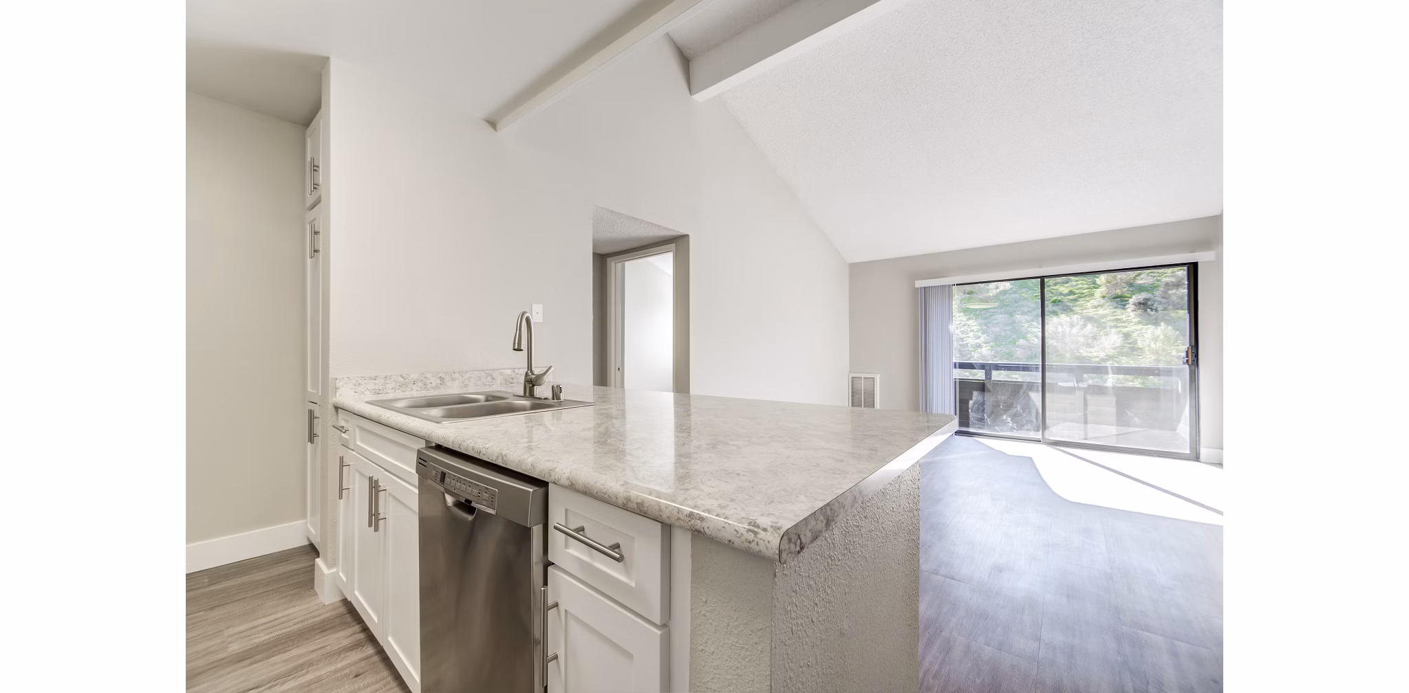 Modern kitchen featuring stainless steel appliances at Presidio at Rancho Del Oro Apartments