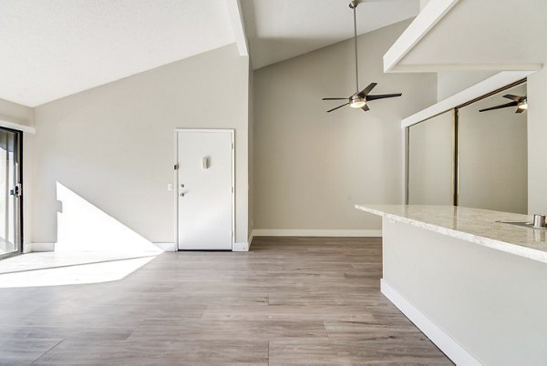 Spacious living room with modern decor at Presidio at Rancho Del Oro Apartments