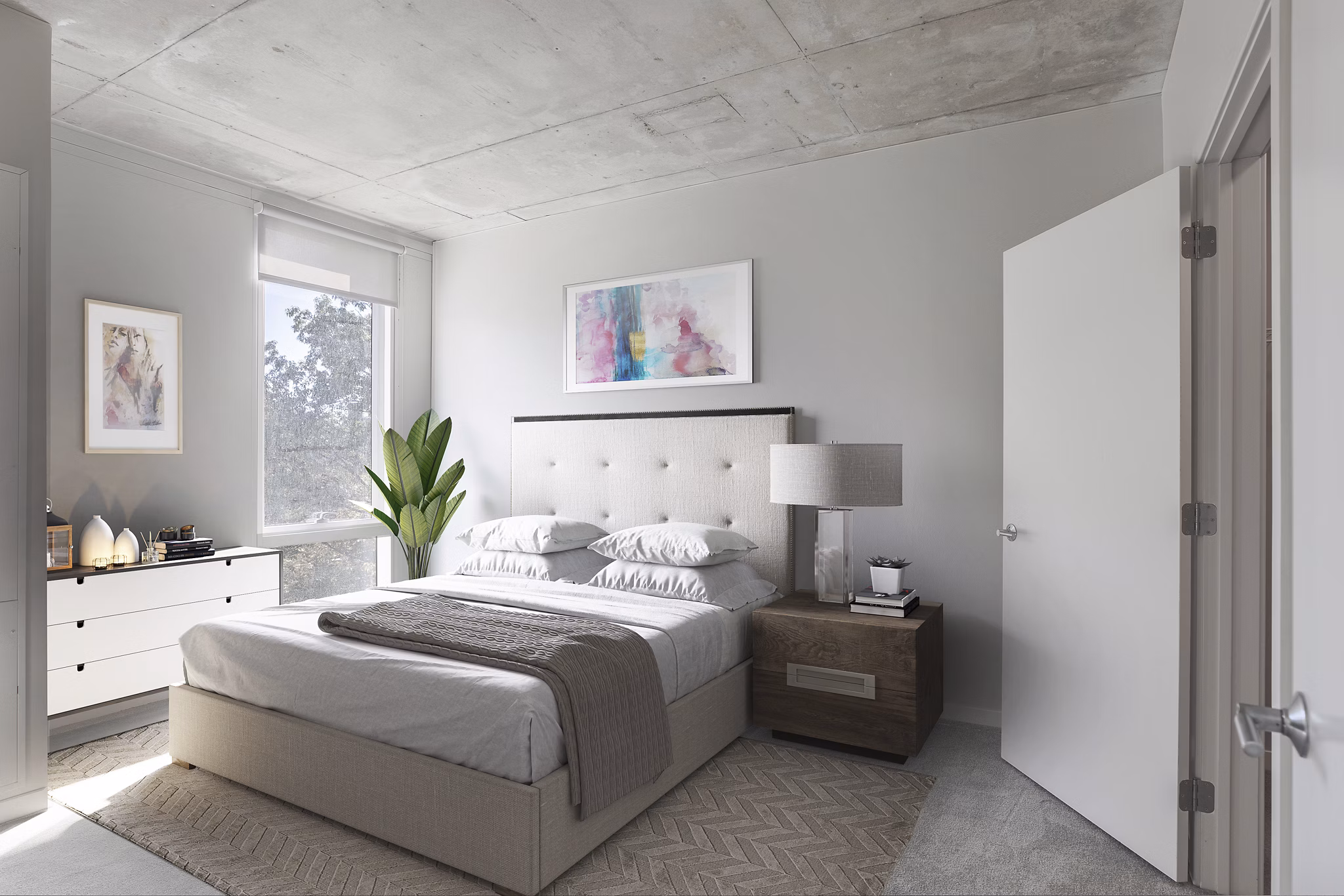 Modern bedroom with minimalist decor at The Chestnut Apartments