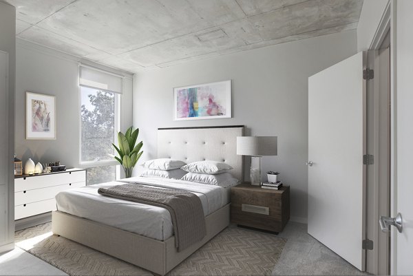 Modern bedroom with minimalist decor at The Chestnut Apartments