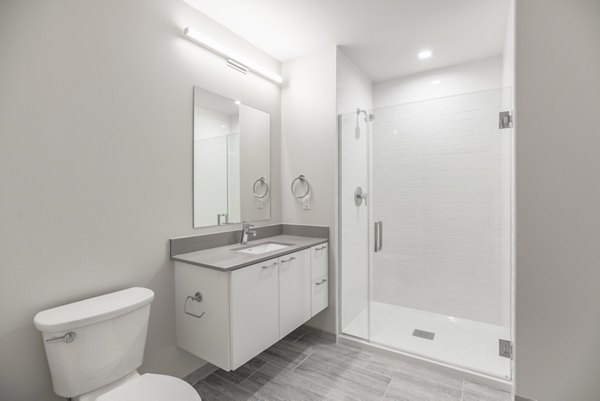 Modern bathroom with sleek fixtures at The Chestnut Apartments, a luxury residences under the Greystar brand