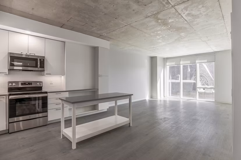 Modern kitchen with stainless steel appliances at The Chestnut Apartments, a luxury Greystar property