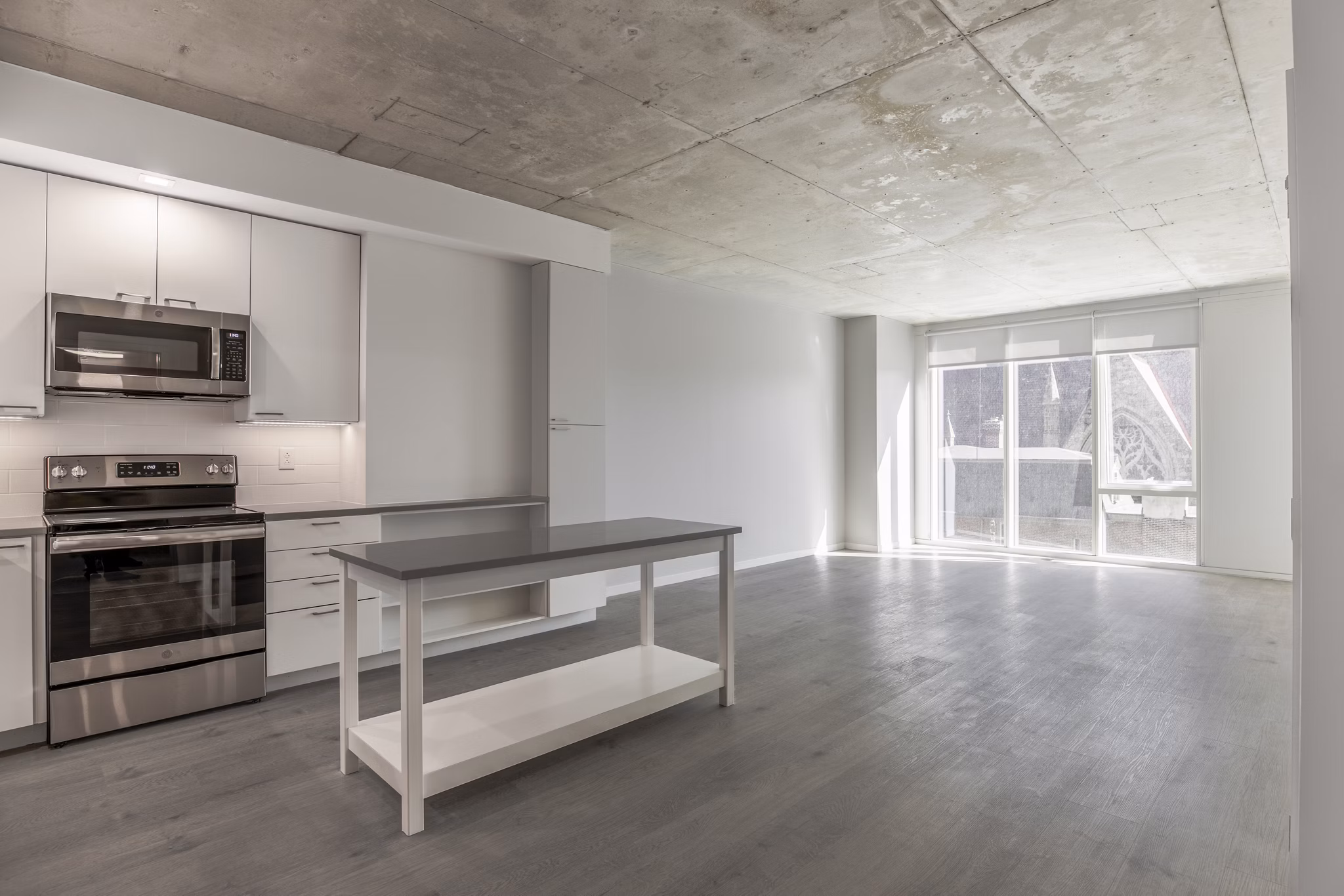 Modern kitchen with stainless steel appliances at The Chestnut Apartments, a luxury Greystar property
