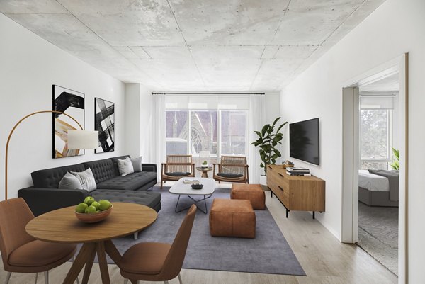 Spacious living room with modern furnishings in The Chestnut Apartments, luxury apartments by Greystar