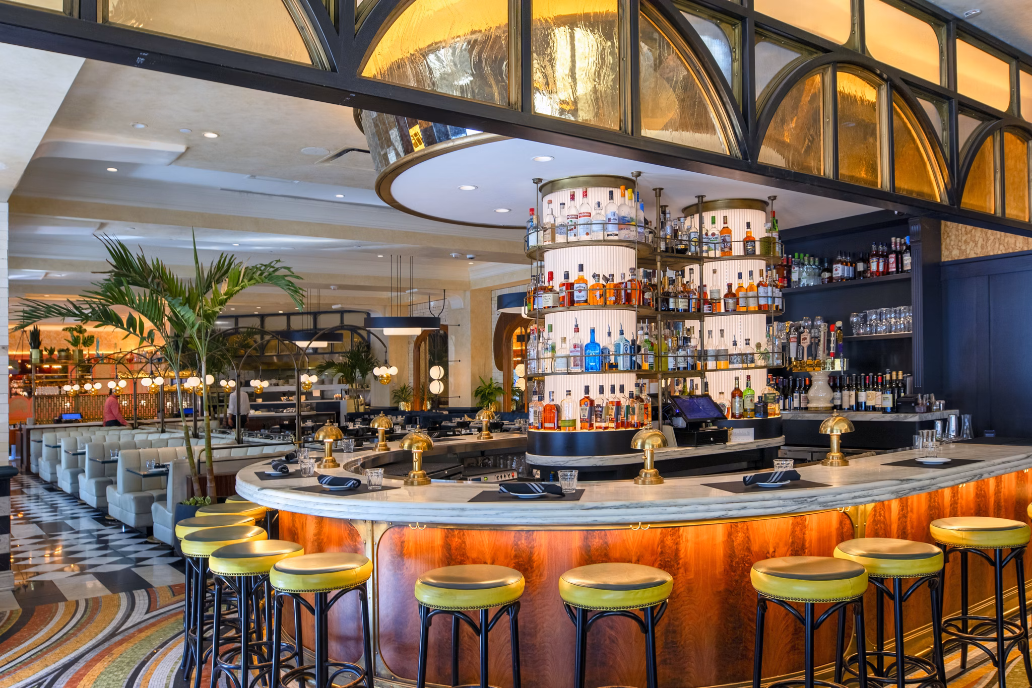 Modern bar area with circular counter and stylish seating at luxury apartments
