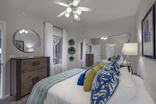 Cozy bedroom with modern furnishings at Springs at Continental Ranch Apartments