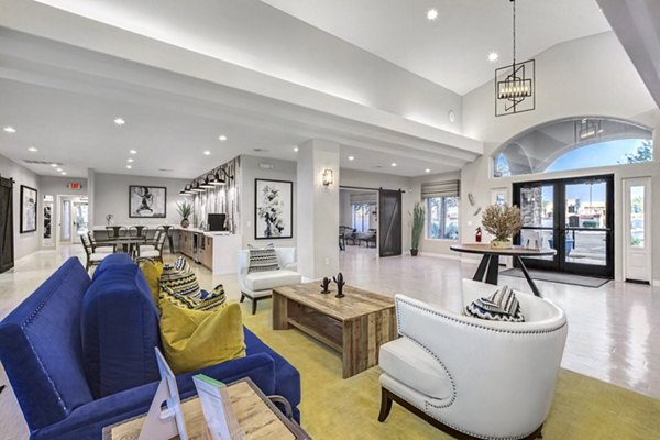 Clubhouse featuring a modern lounge and community space at Springs at Continental Ranch Apartments