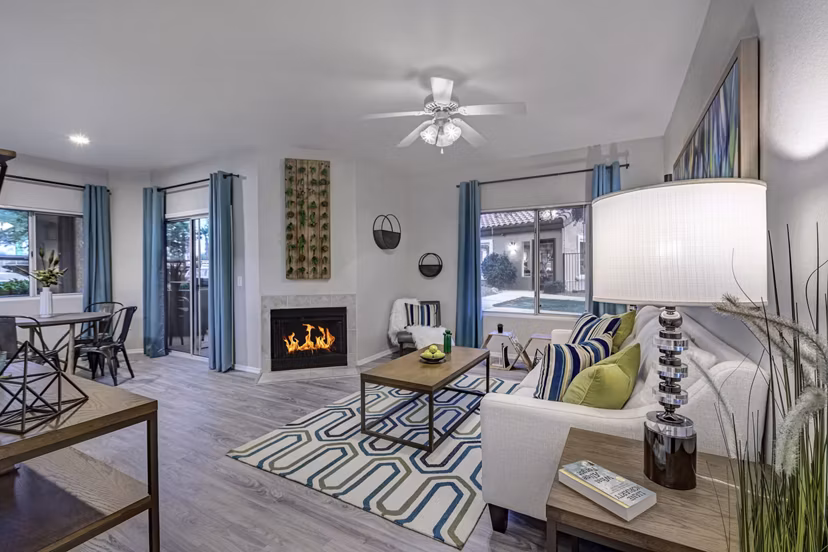 Cozy living room with modern furnishings at Springs at Continental Ranch Apartments, featuring ample natural light and stylish decor