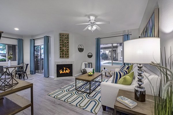 Cozy living room with modern furnishings at Springs at Continental Ranch Apartments, featuring ample natural light and stylish decor