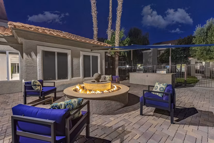 Fire pit area with cozy seating at Springs at Continental Ranch Apartments Perfect for social gatherings or relaxing evenings outdoors