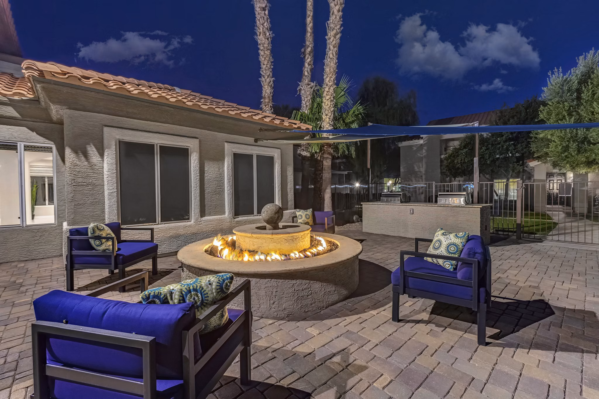 Fire pit area with cozy seating at Springs at Continental Ranch Apartments Perfect for social gatherings or relaxing evenings outdoors