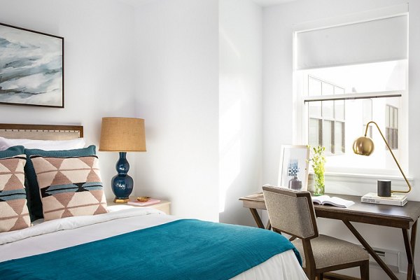 Modern bedroom with stylish decor at The Madelon Apartments