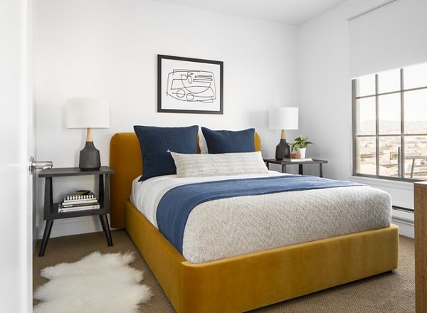The Madelon Apartments: Cozy bedroom featuring modern decor and city views
