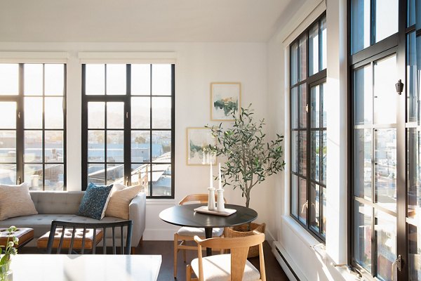 Dining area with elegant modern decor at The Madelon Apartments, luxury living in vibrant urban setting