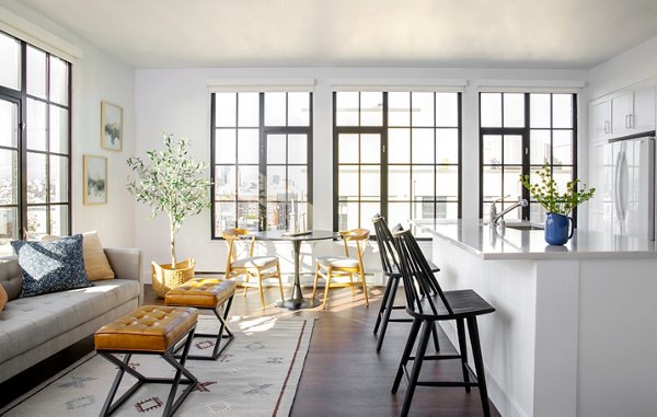 Dining area featuring modern design and elegant lighting at The Madelon Apartments