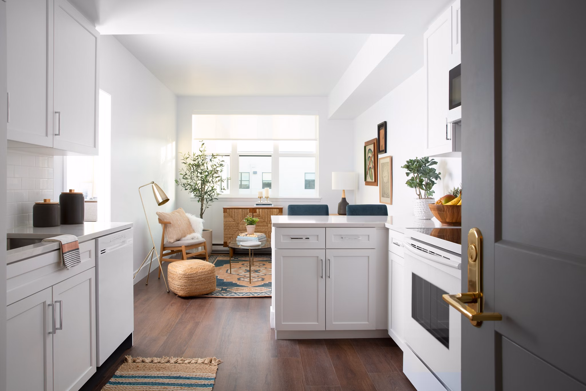 Modern kitchen with sleek countertops and stainless steel appliances at The Madelon Apartments
