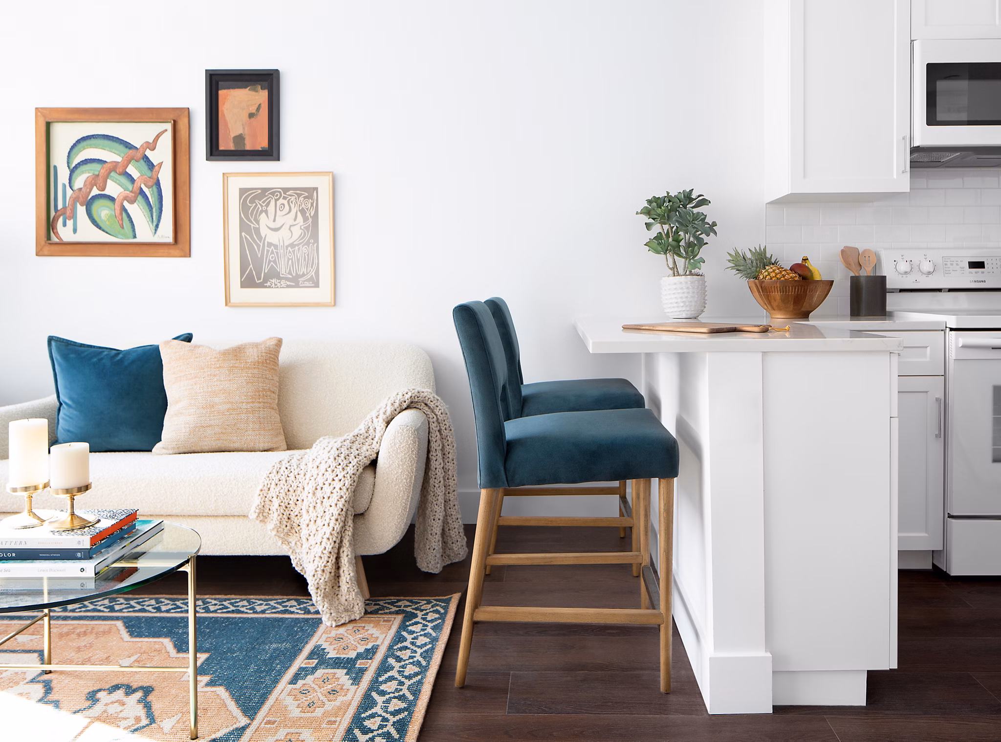 Living room with cozy seating and modern decor at The Madelon Apartments, luxury living in the heart of the city