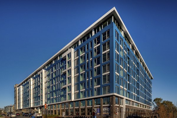 Luxury apartments with a striking blue and white facade in a contemporary multi-story building