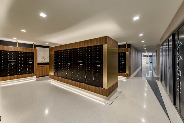 Modern mailroom with multiple mailboxes in luxury apartment community