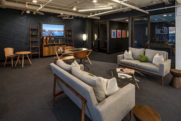 Modern lounge area featuring sofas, chairs, and decorative elements in luxury apartments