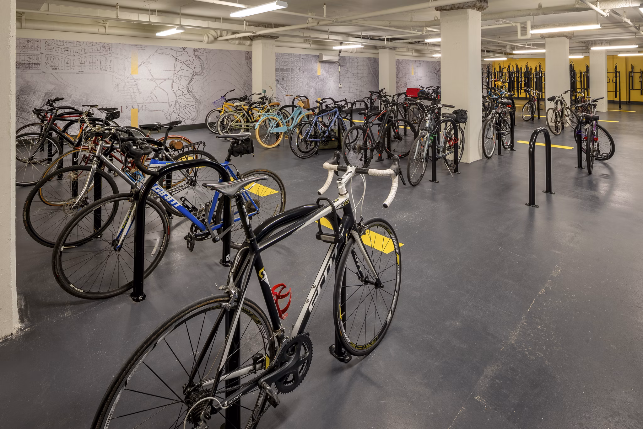 Bicycle storage area featuring secure racks for multiple bikes at luxury apartments