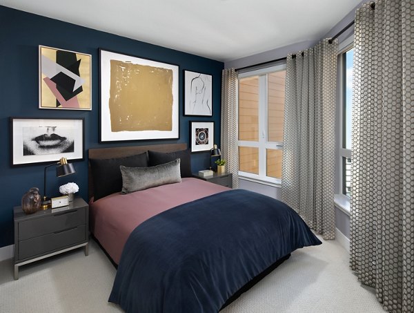Cozy bedroom with modern design featuring plush bedding at Lynhaven Apartments