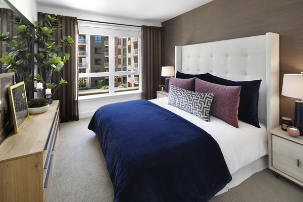 Bedroom featuring modern design and large windows in Lynhaven Apartments
