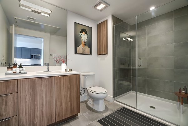 Lynhaven Apartments: Modern bathroom with sleek fixtures and spacious vanity in luxury setting