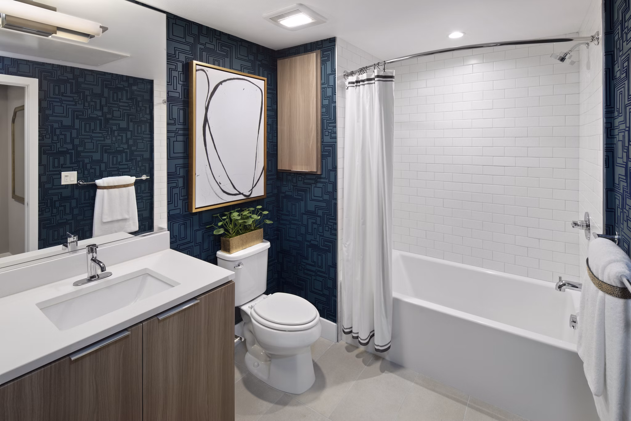 Bathroom with modern fixtures and elegant tiling at Lynhaven Apartments