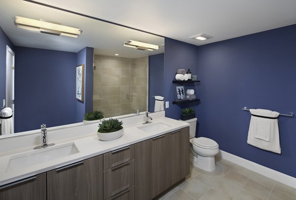 Lynhaven Apartments: Elegant bathroom with modern fixtures and granite countertops, featuring a sleek design